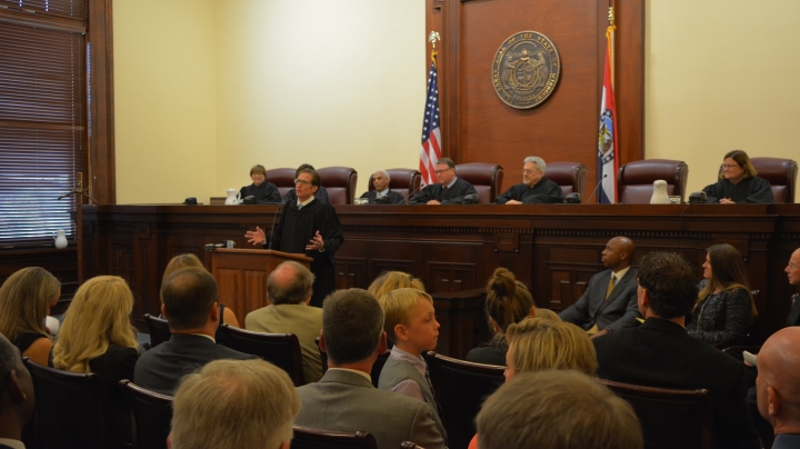 photo of Judge Brent Powell addressing audience during investiture