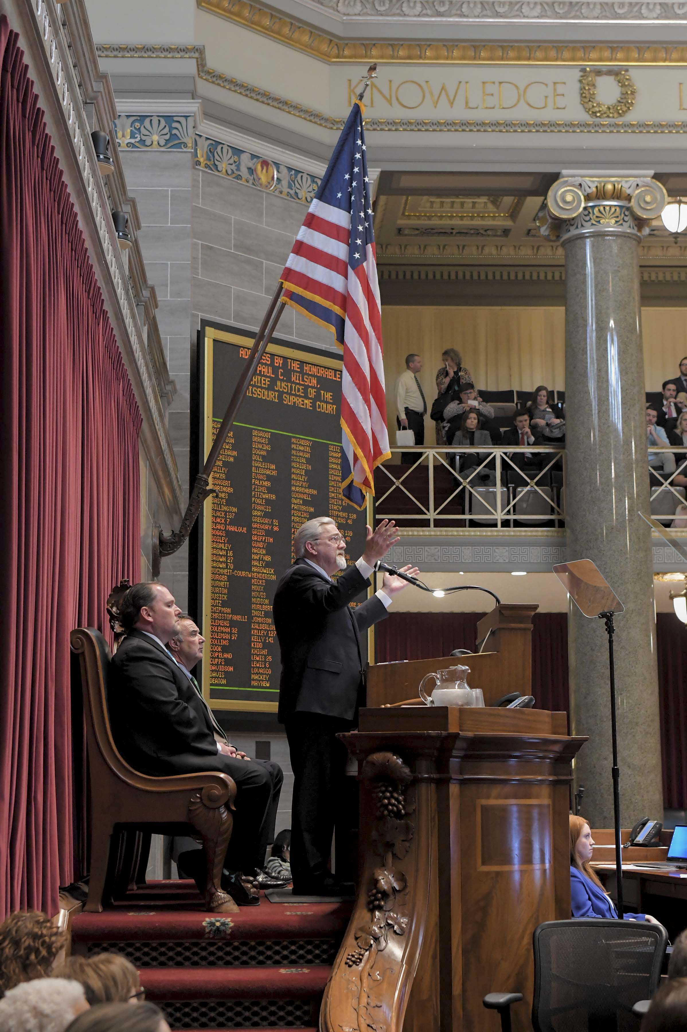 2022 - CJ Wilson gestures to virtues carved into House chamber 994