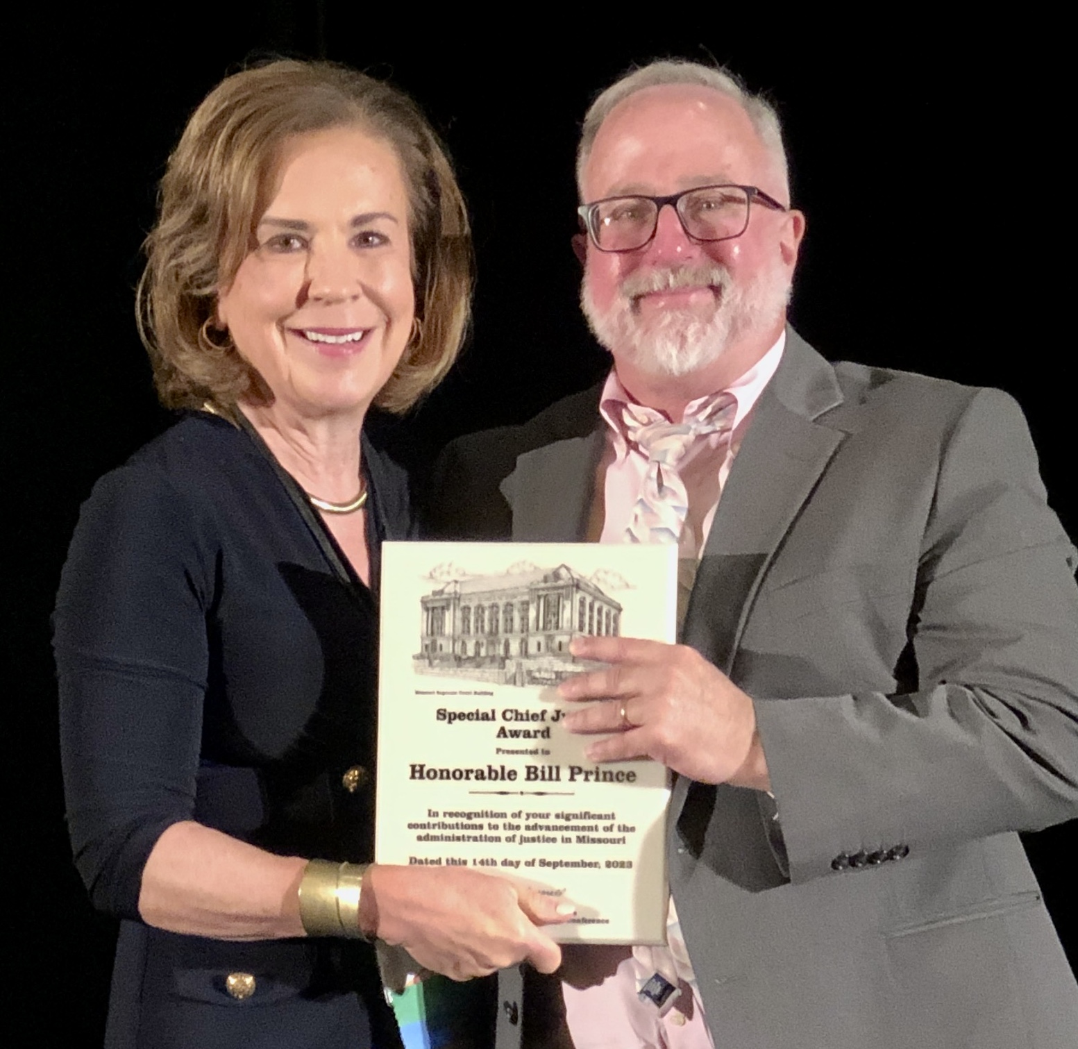 Chief Justice Mary Russell presents award to Bill Prince