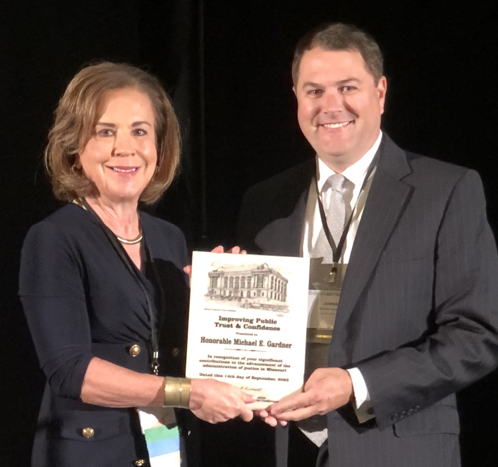 Chief Justice Mary Russell presents award to Judge Michael Gardner
