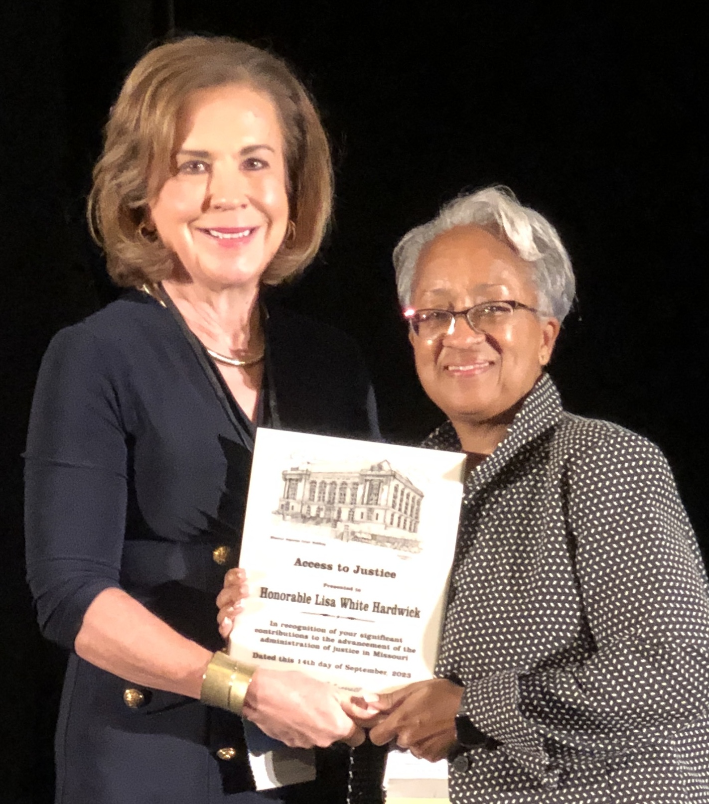 Chief Justice Mary Russell presents award to Judge Lisa White Hardwick