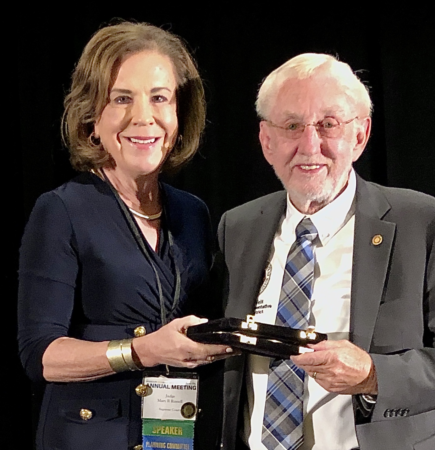 Chief Justice Mary Russell presents award to Representative Rudy Viet