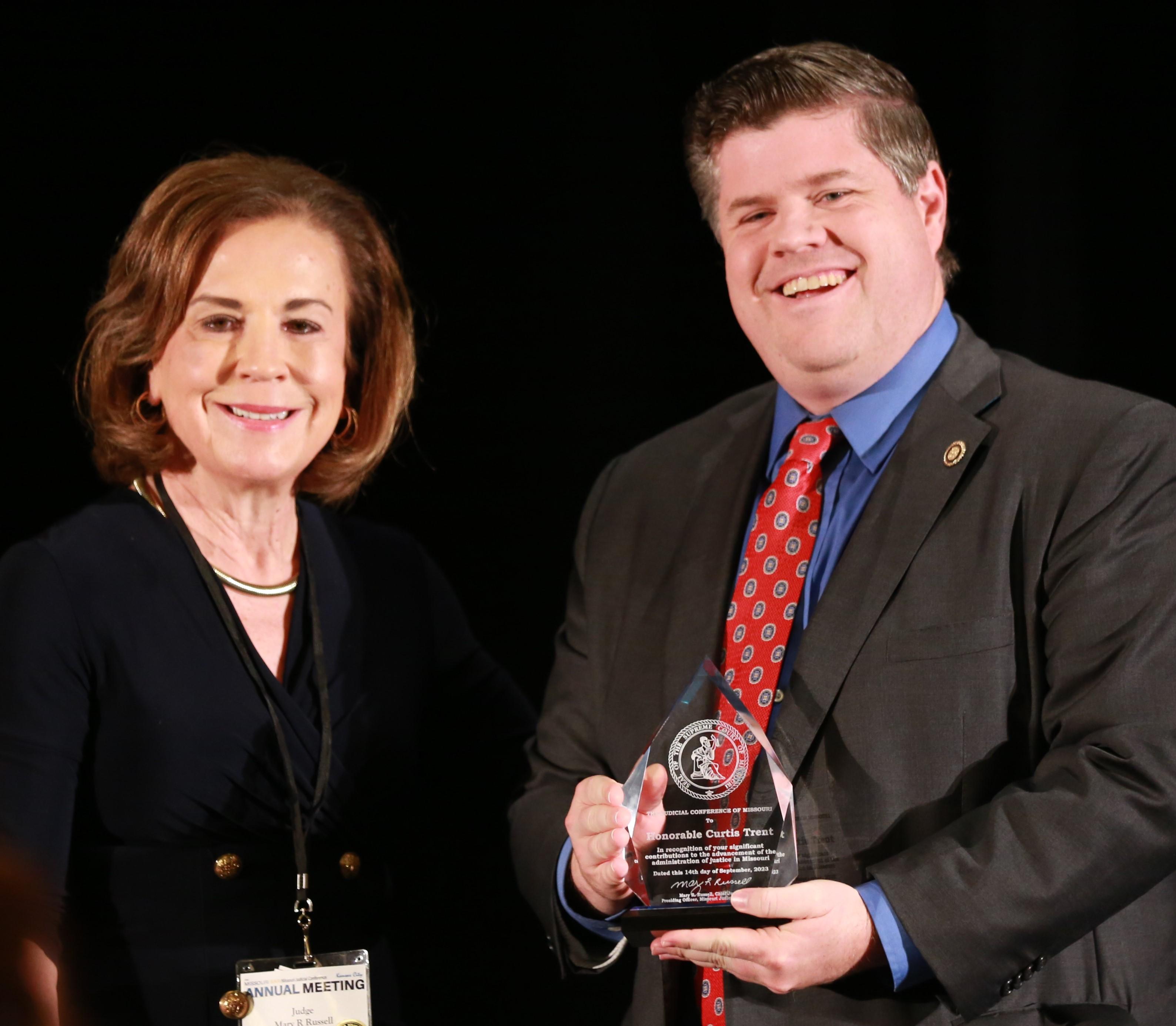 Chief Justice Mary Russell presents award to Senator Curtis Trent