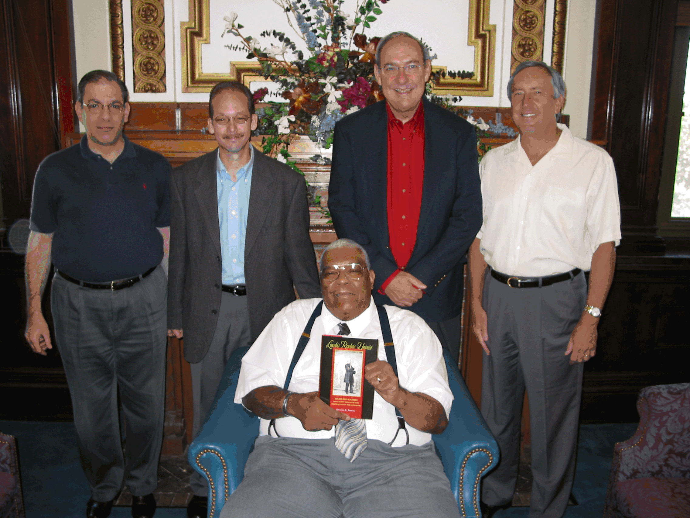 Photo of Supreme Court Librarian Tyronne Allen holding the new biography